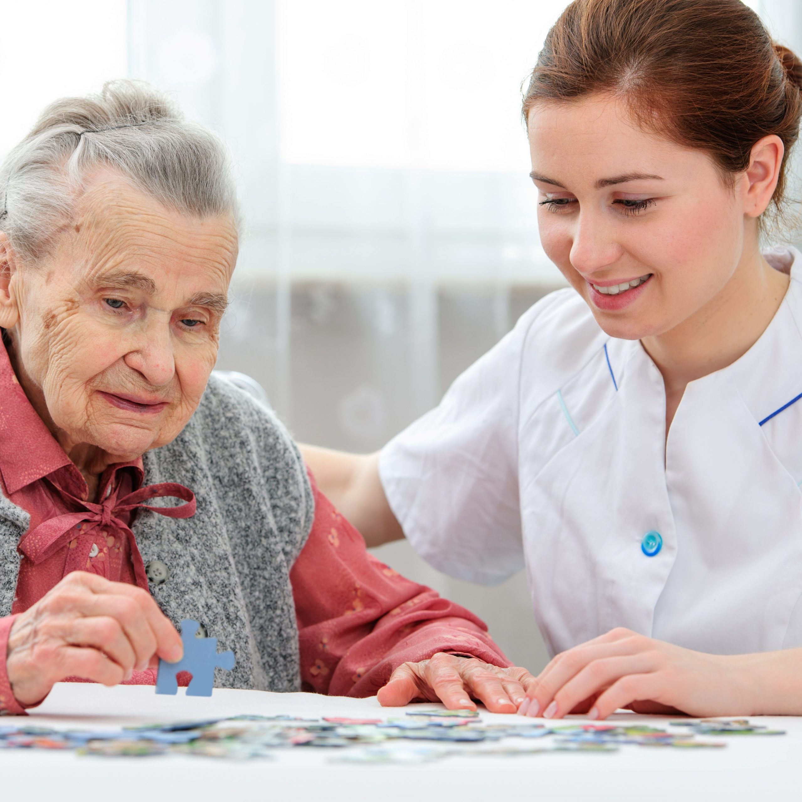 picture of a care worker helping an older lady